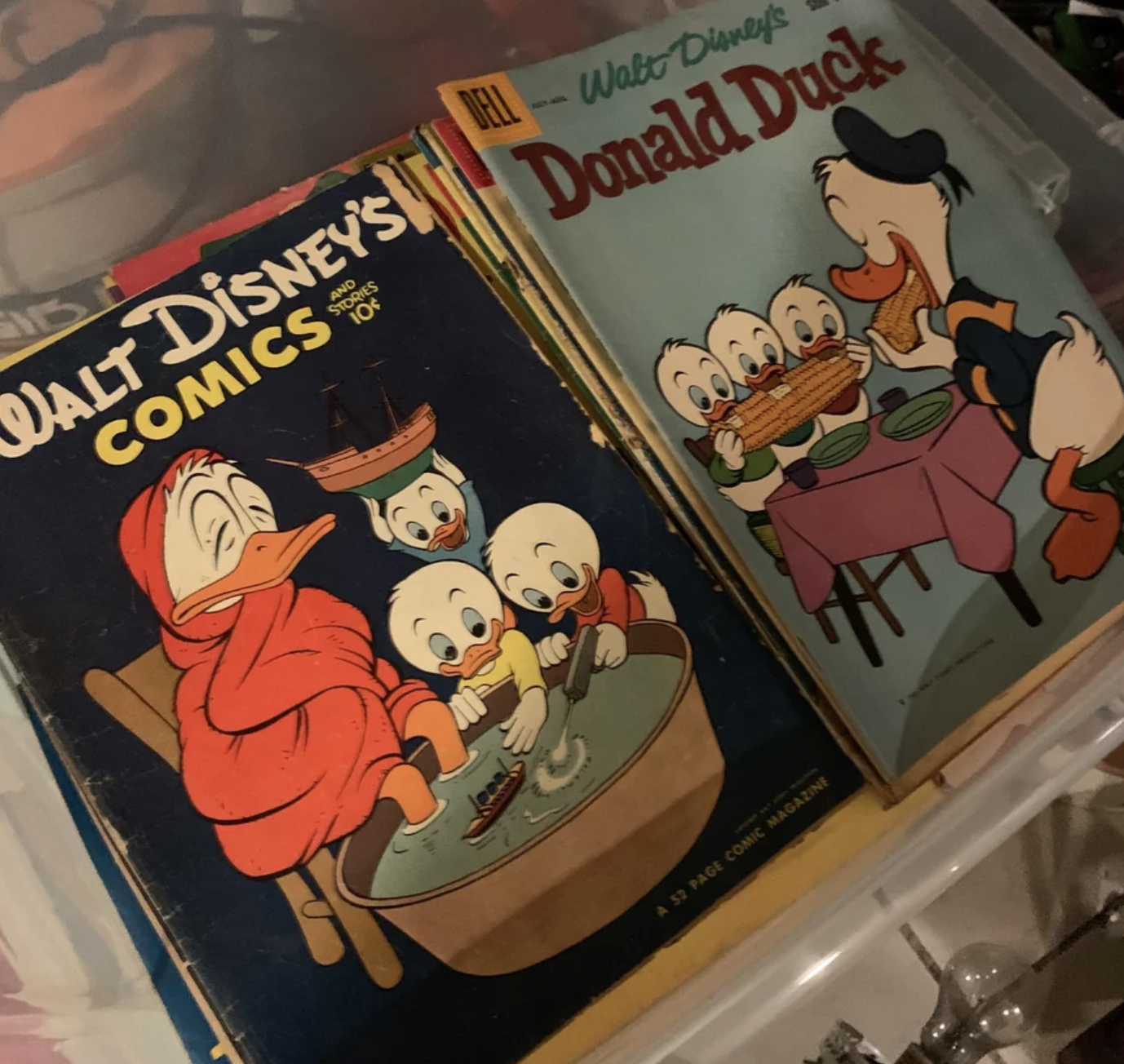 Two stacks of Disney comic books are being shown