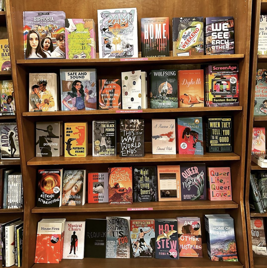 A shelf is full of front-facing novels.