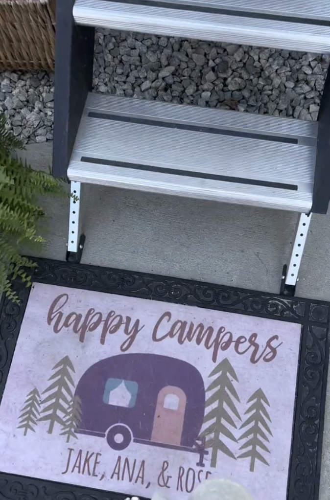 Ana&#x27;s camper mat outside of their door