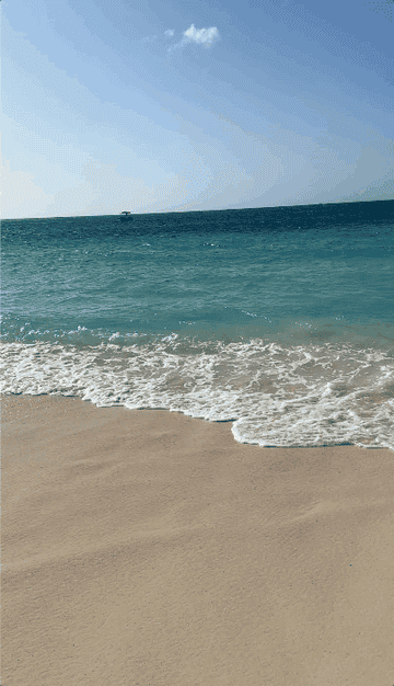 A gif of waves coming into a beach