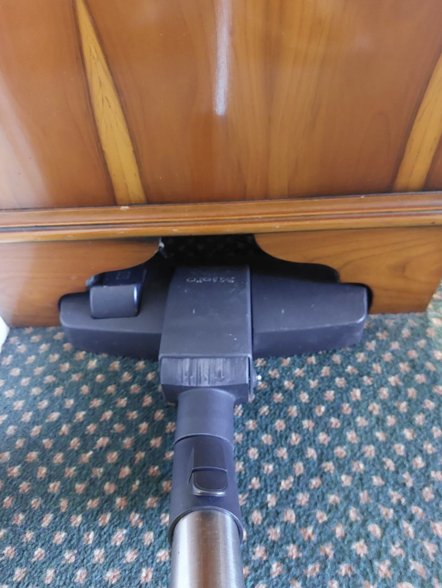 cabinet bottom with a weird shape perfectly fit a small hoover vacuum