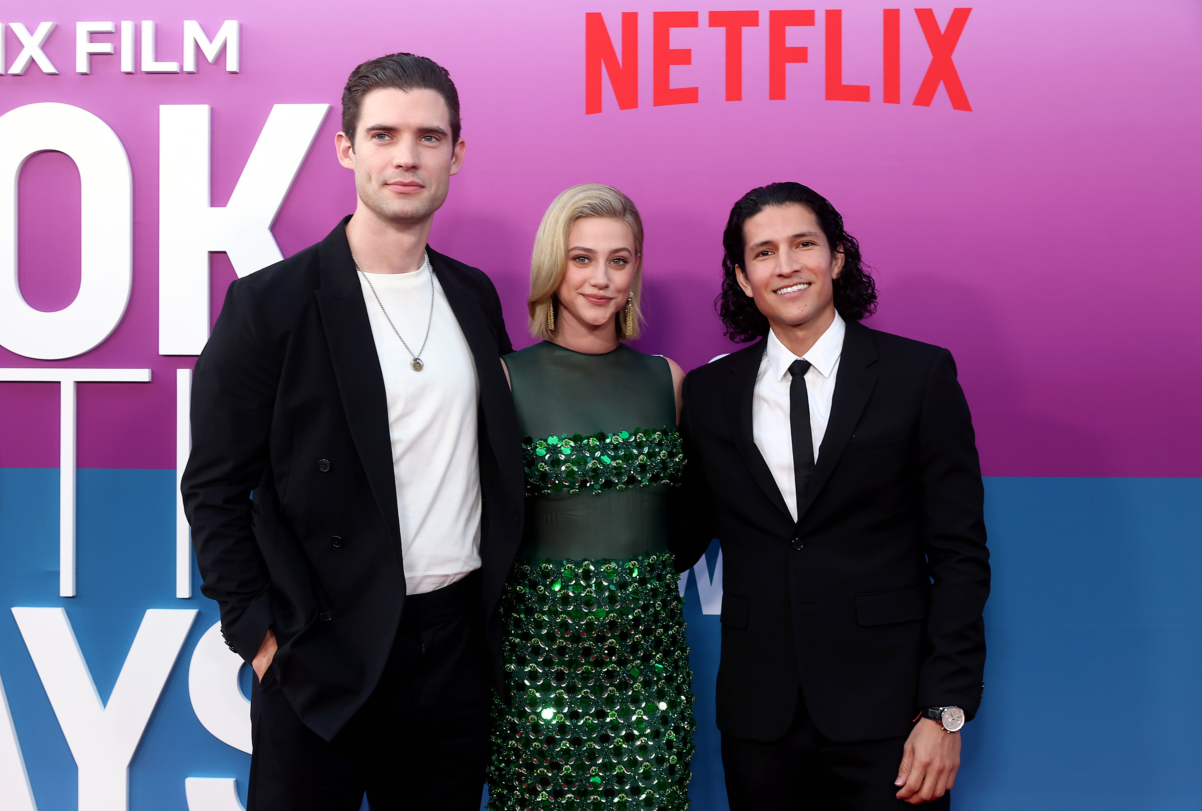 David towering over Lili and Danny on the red carpet