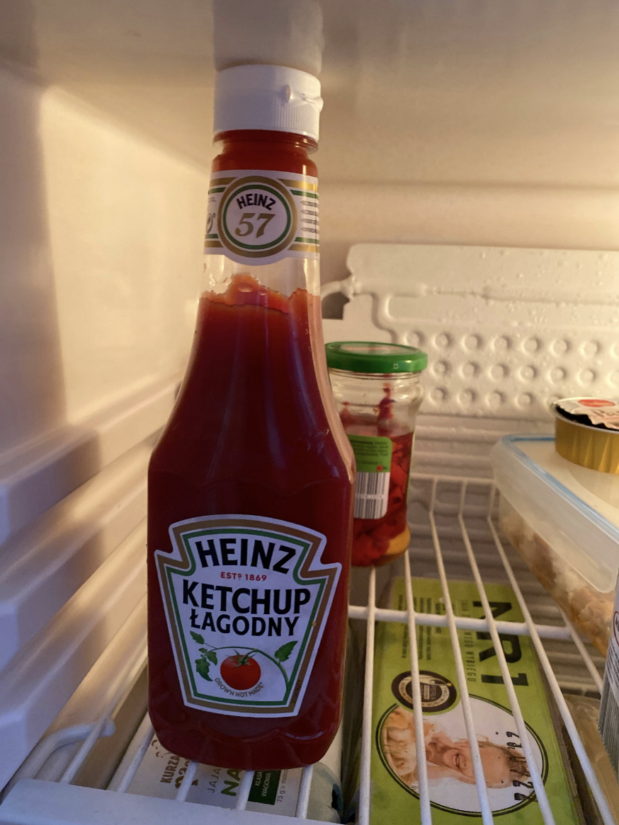 kitchen touching the top of the fridge