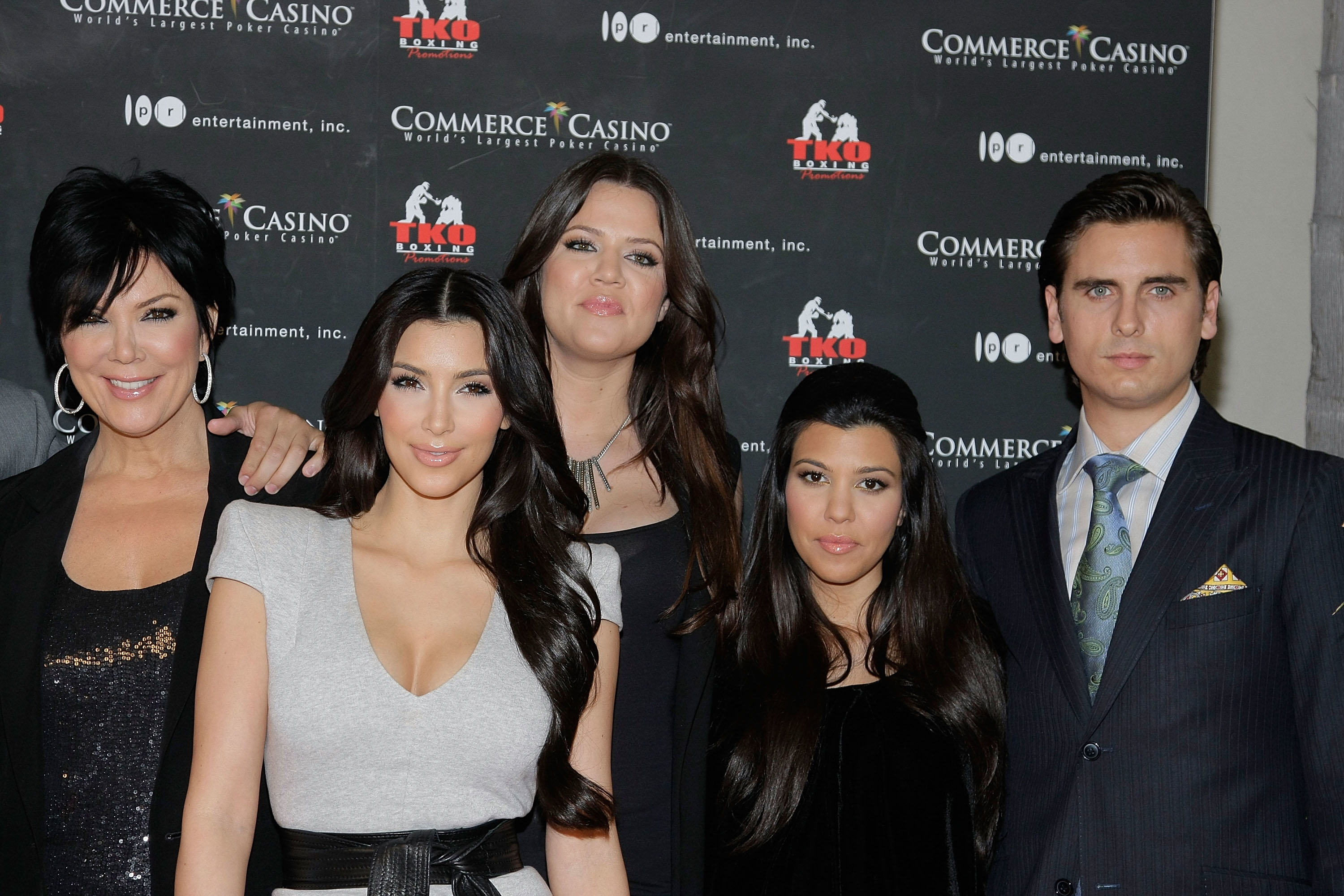 Close-up of Scott with Khloé, Kim, Kourtney, and Kris at a media event