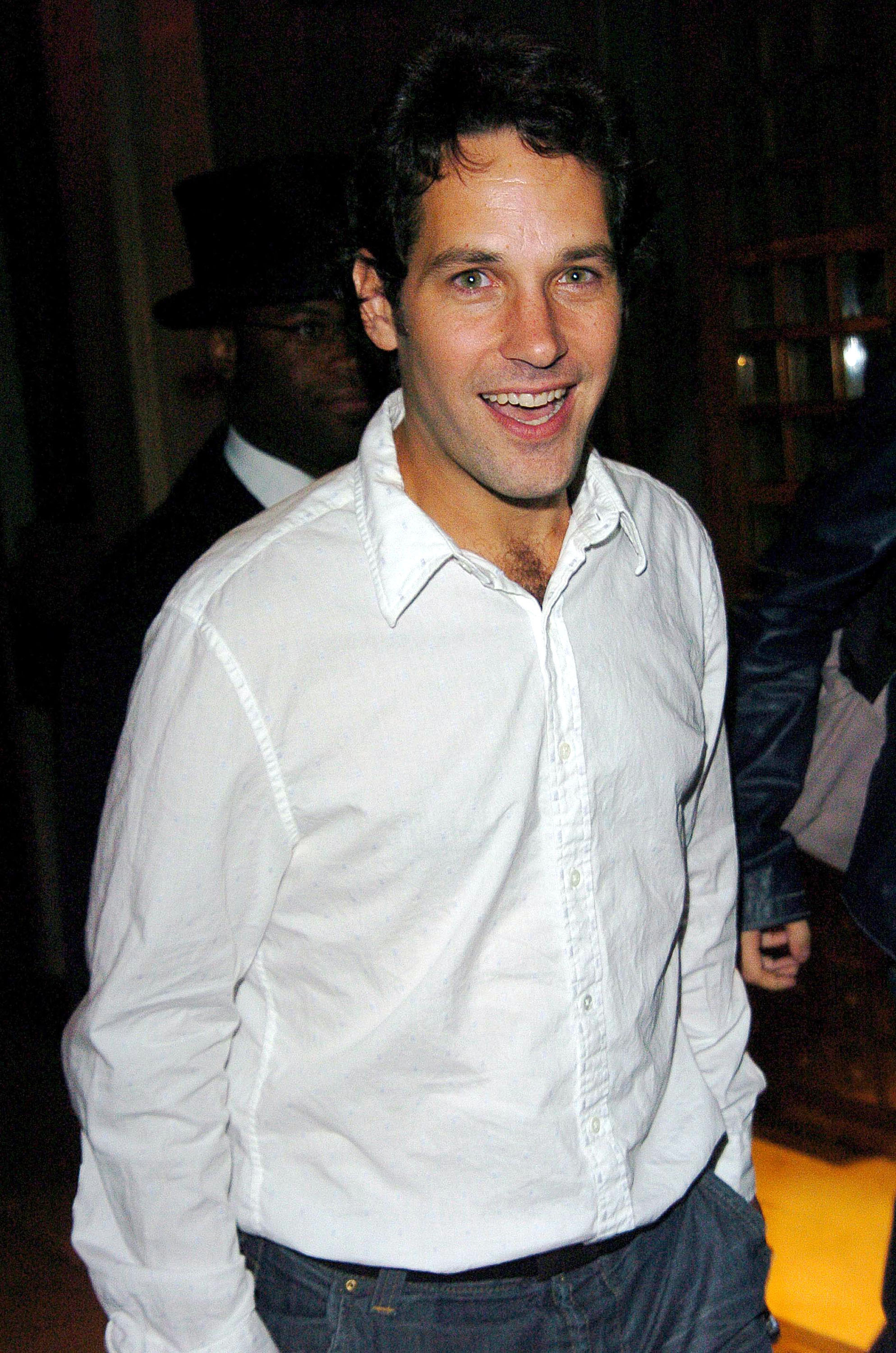 Close-up of Paul in a button-front shirt and jeans