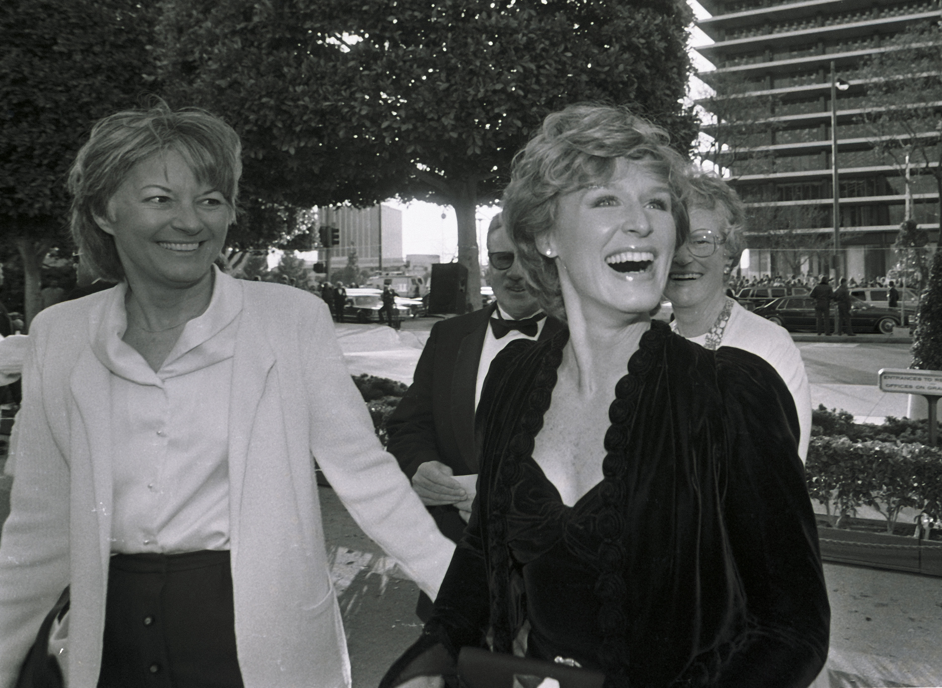 Glenn smiling with several other people outdoors