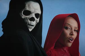 Doja Cat and a skeleton turning to look at the camera in the Paint the Town Red music video