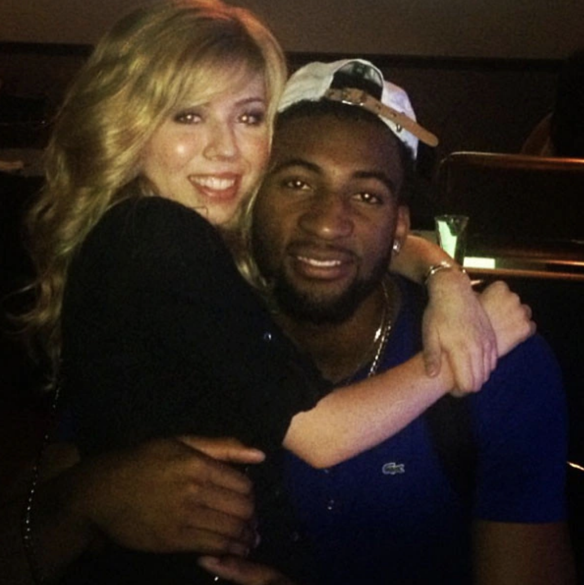 a picture of Jeanette McCurdy and Andre Drummond in an embrace