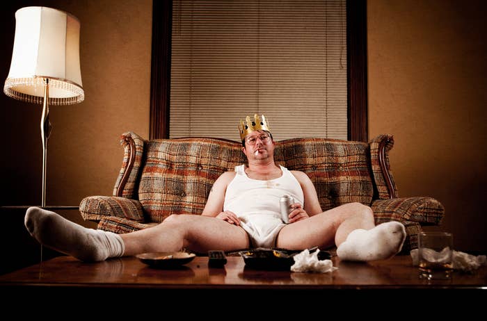 Person in their underwear on the couch drinking beer