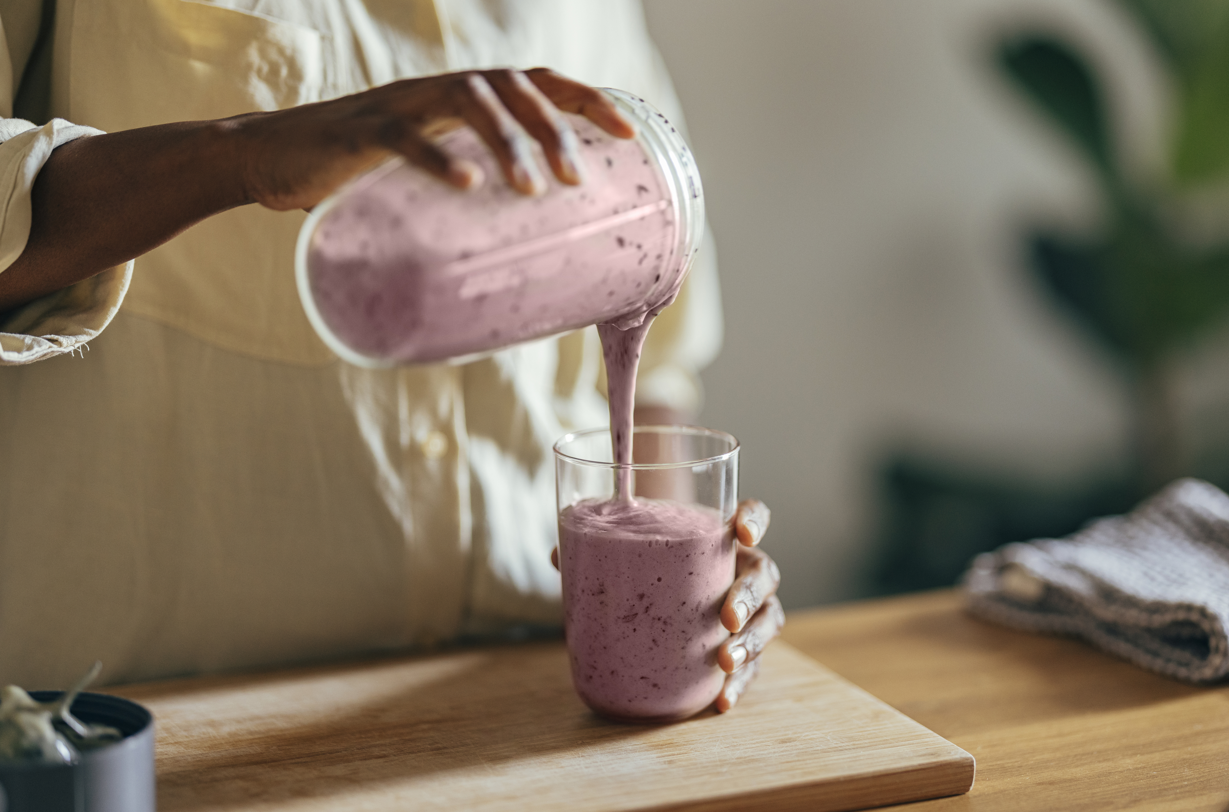A person making a smoothie at home