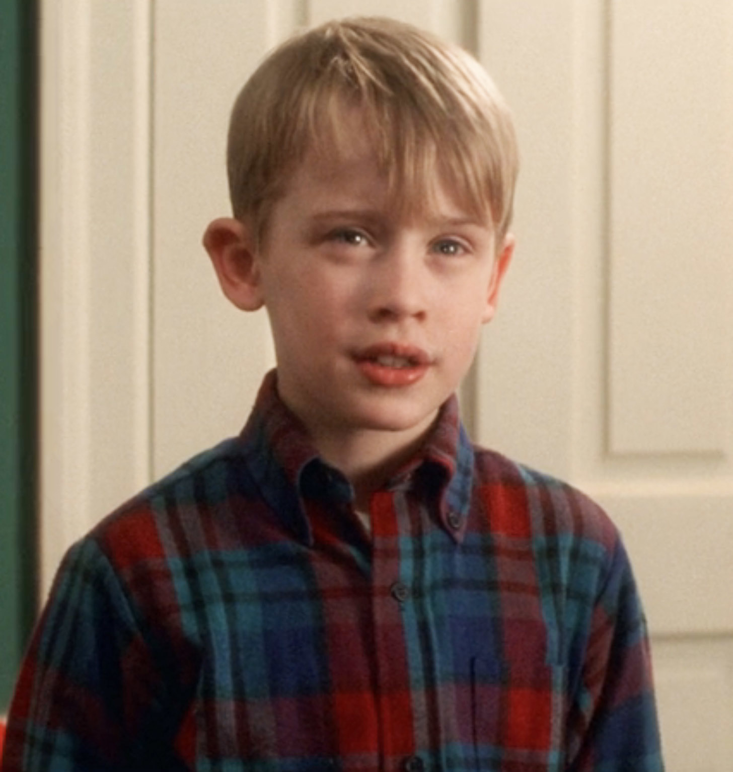 Close-up of Macaulay in a plaid shirt