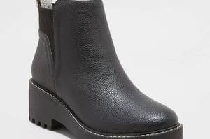 black faux leather boots with thick soles