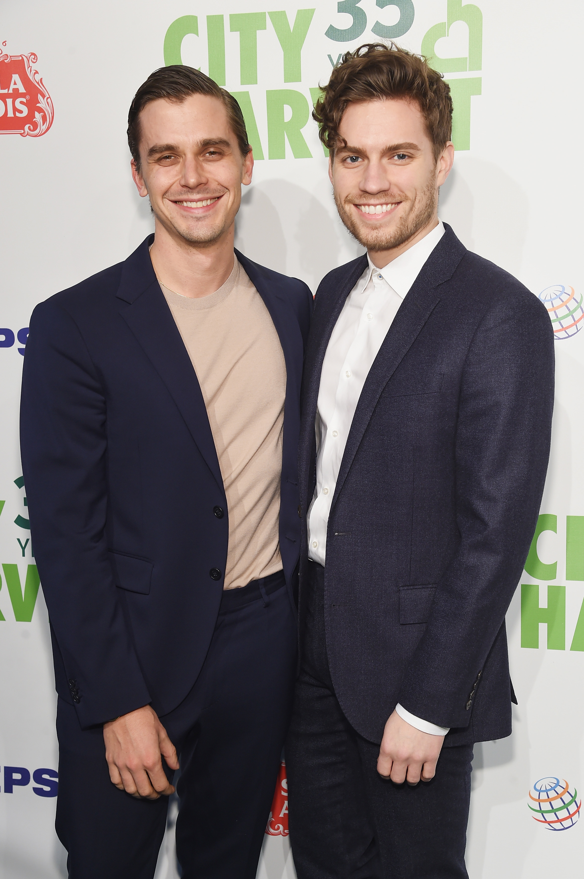 Antoni and Joey smiling at a media event