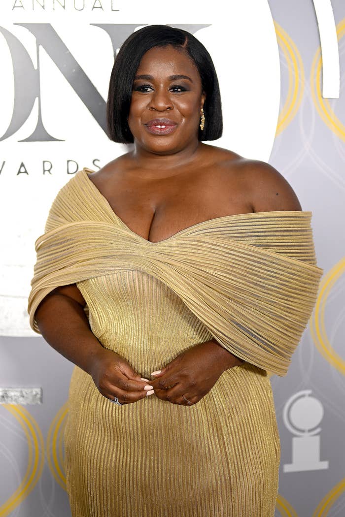 Closeup of Uzo Aduba on the red carpet in an off-the-shoulder gown