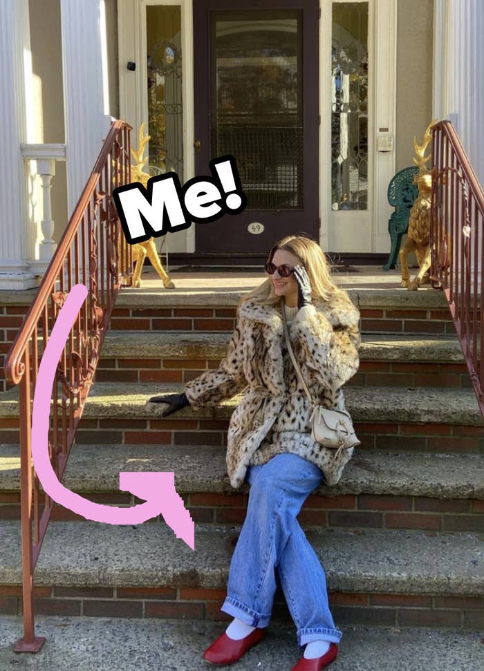 A photo of me in a cheetah print coat sitting on the steps of an old house in Portland, ME