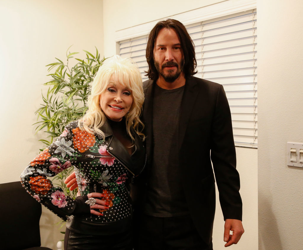 Closeup of Dolly Parton and Keanu Reeves