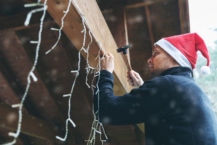 guy hanging up lights