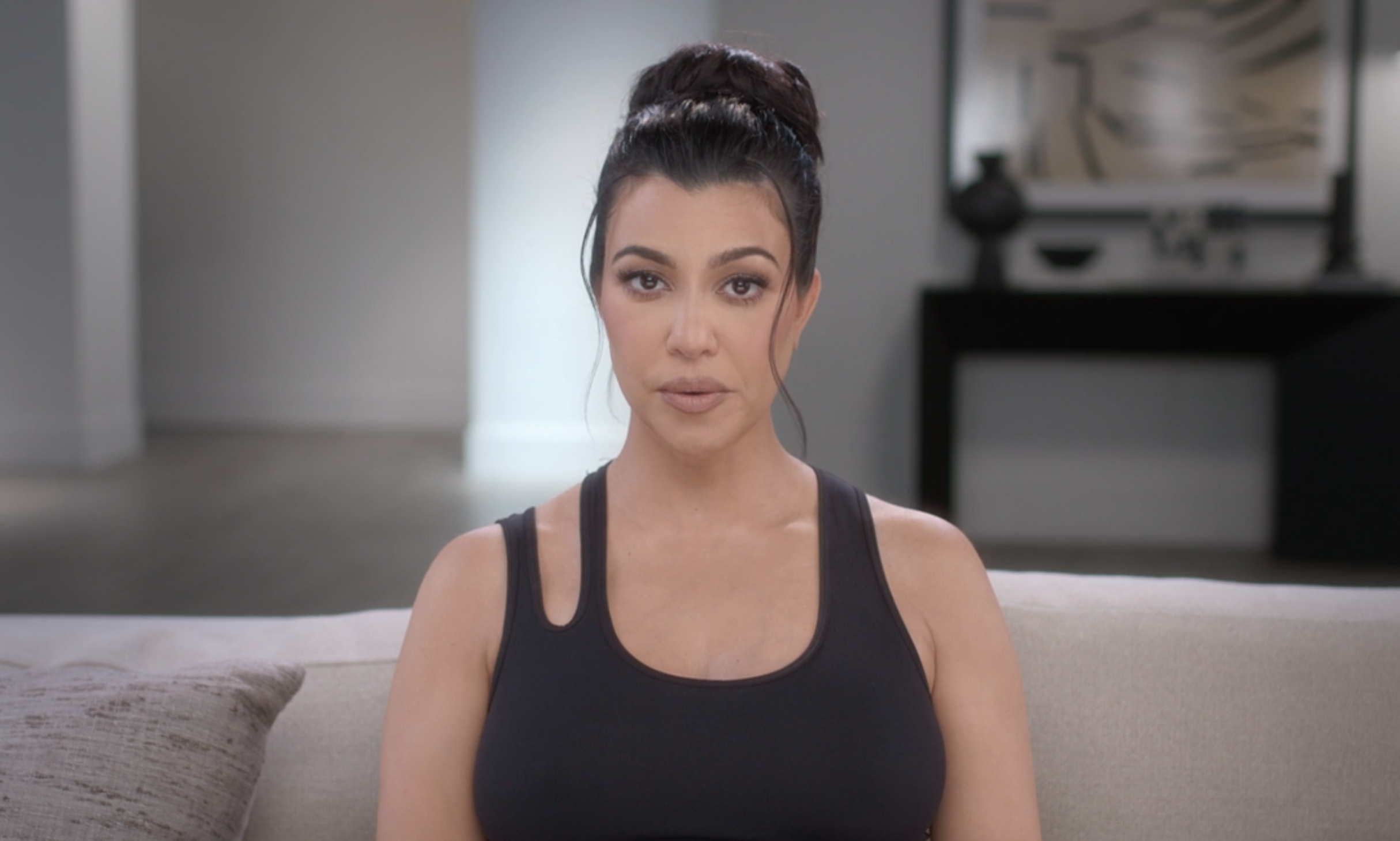 Close-up of Kourtney on a couch