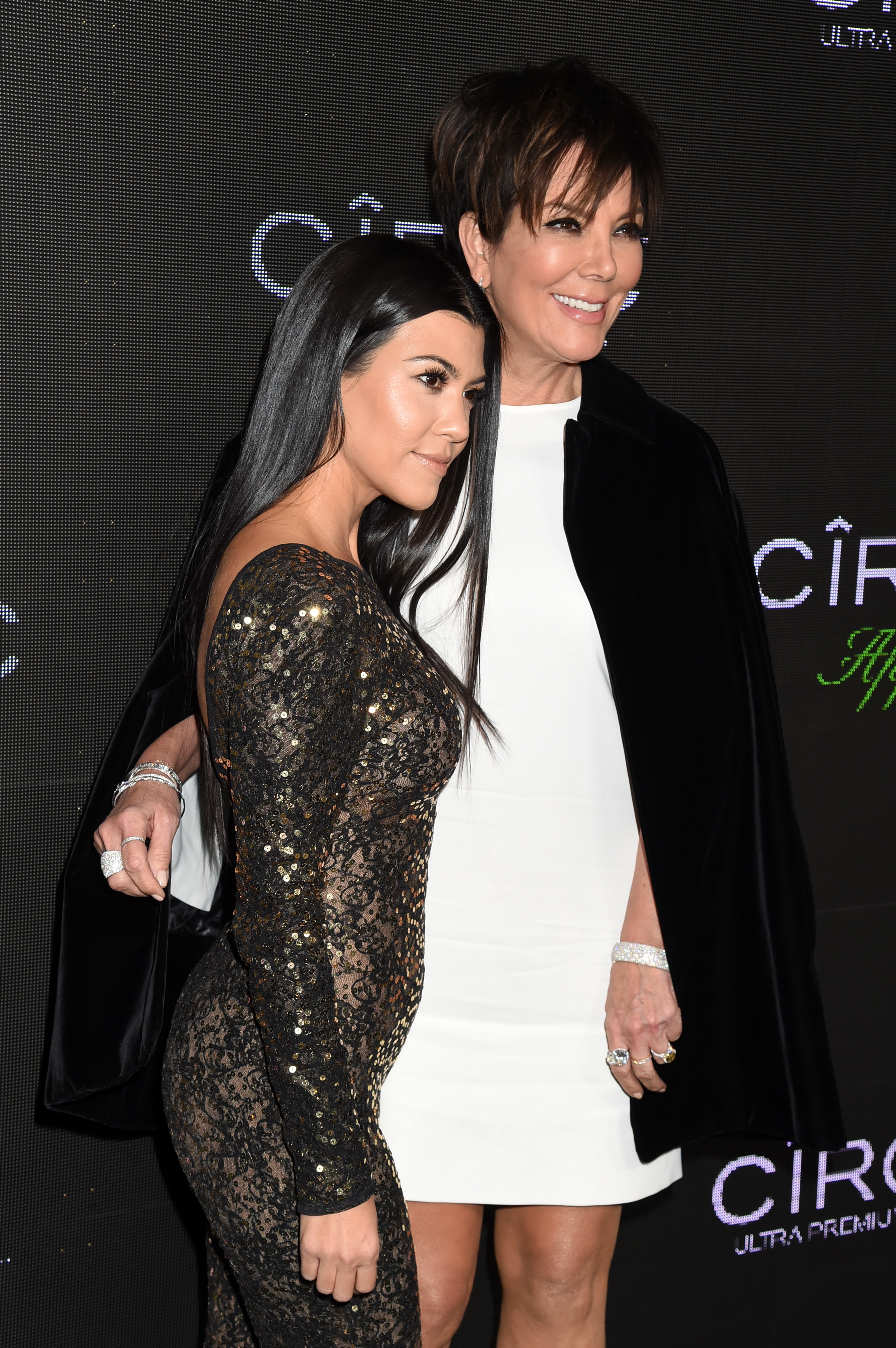 Close-up of Kourtney and Kris at a media event
