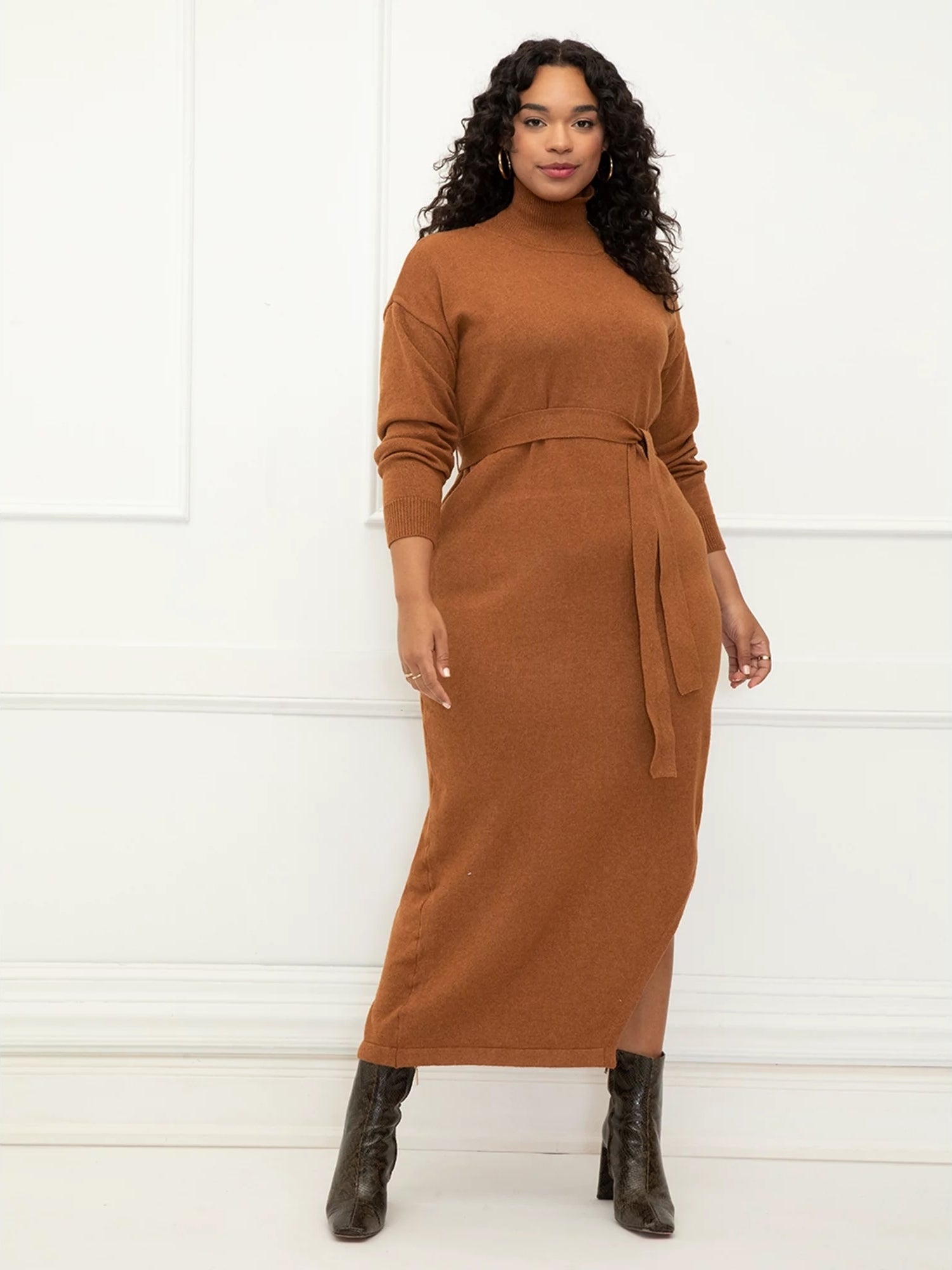 model wearing an orange/brown long sweater dress