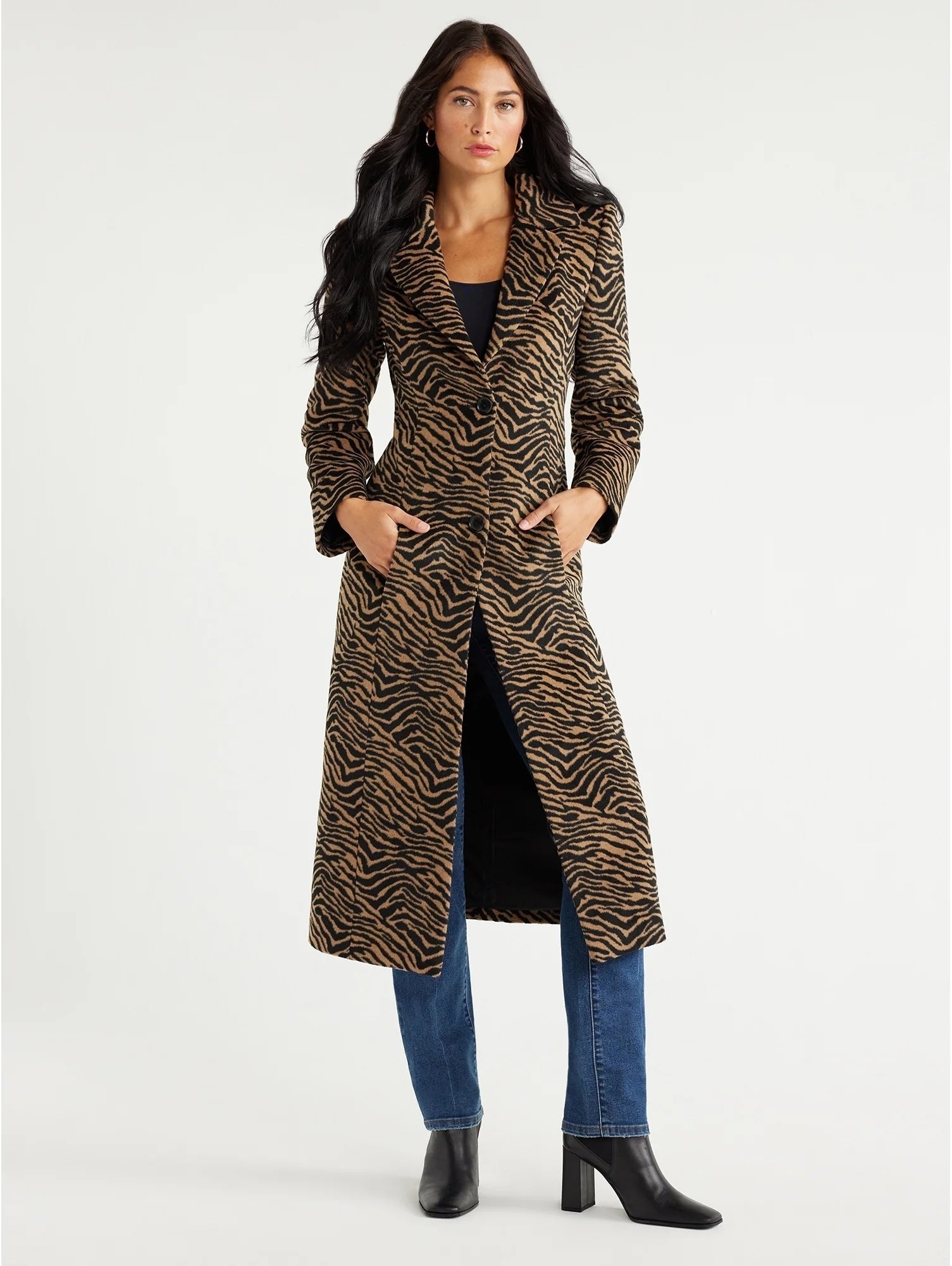 model wearing a long zebra print coat