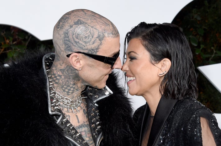 Travis and Kourtney Kardashian Barker smile at each other