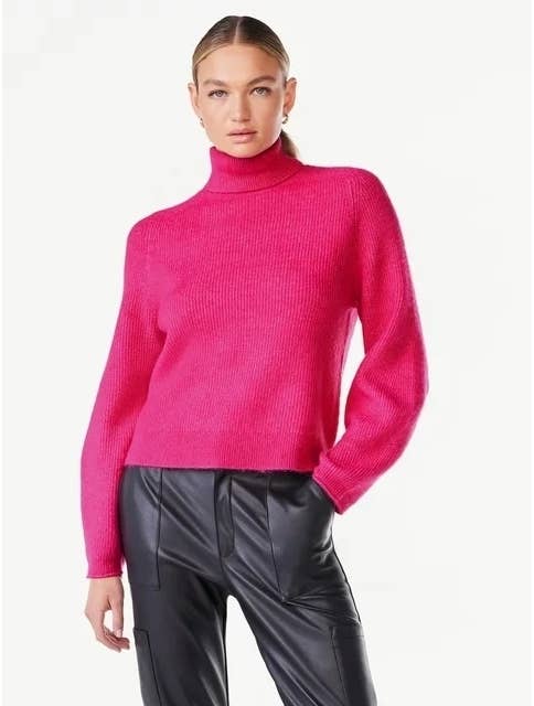 model wearing hot pink turtleneck sweater