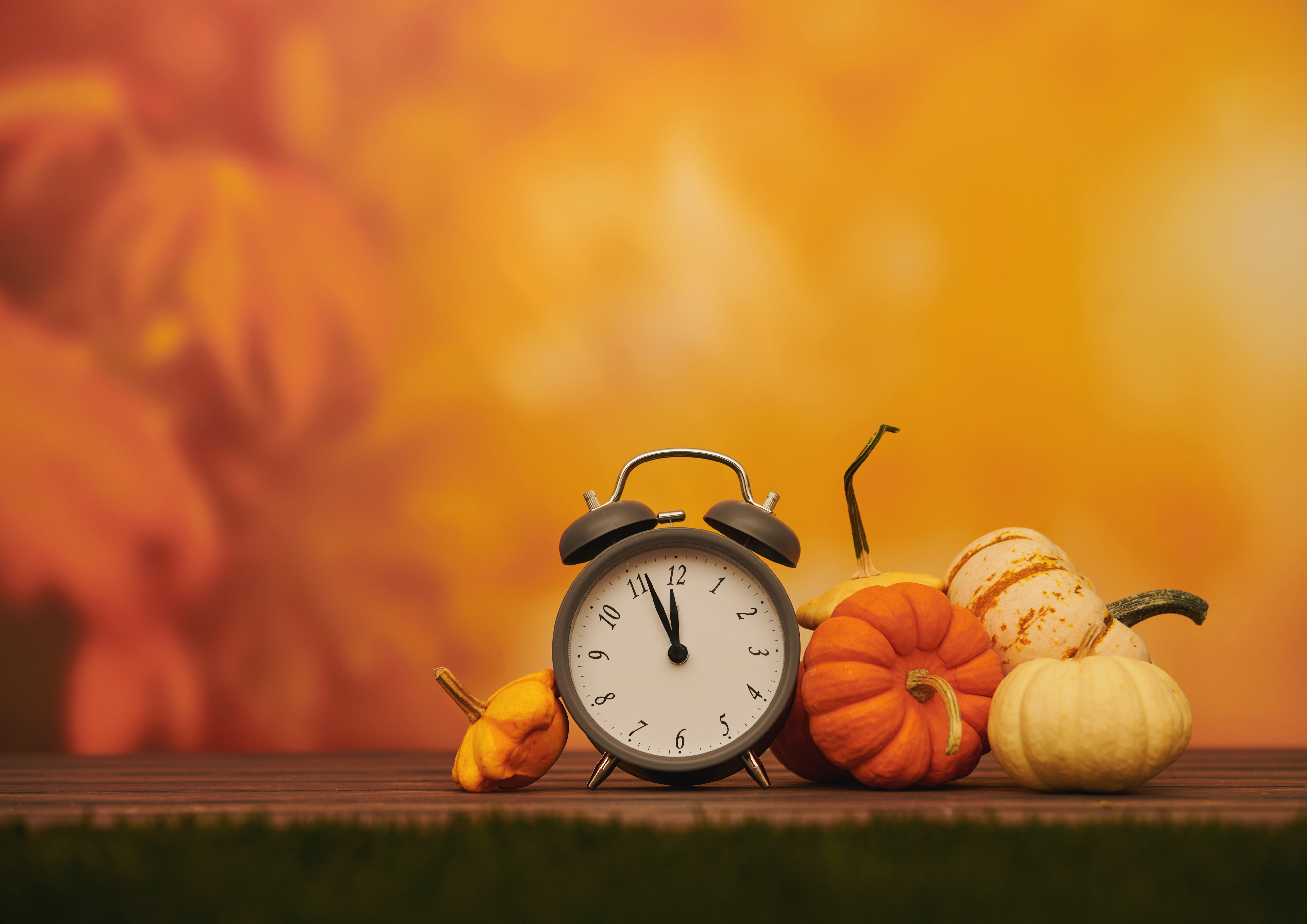 A clock with gourds around it