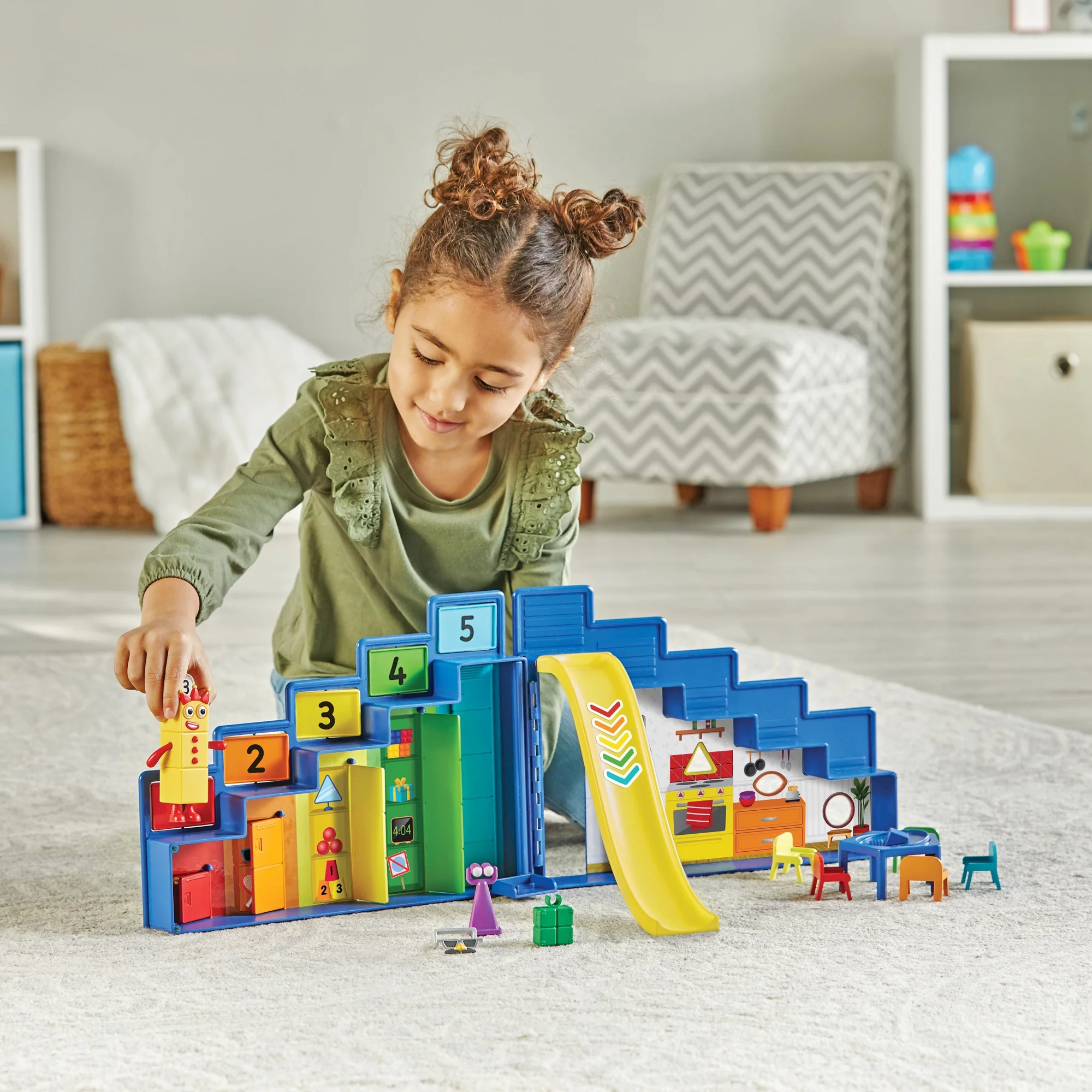 Child playing with colorful Step Squad toy set