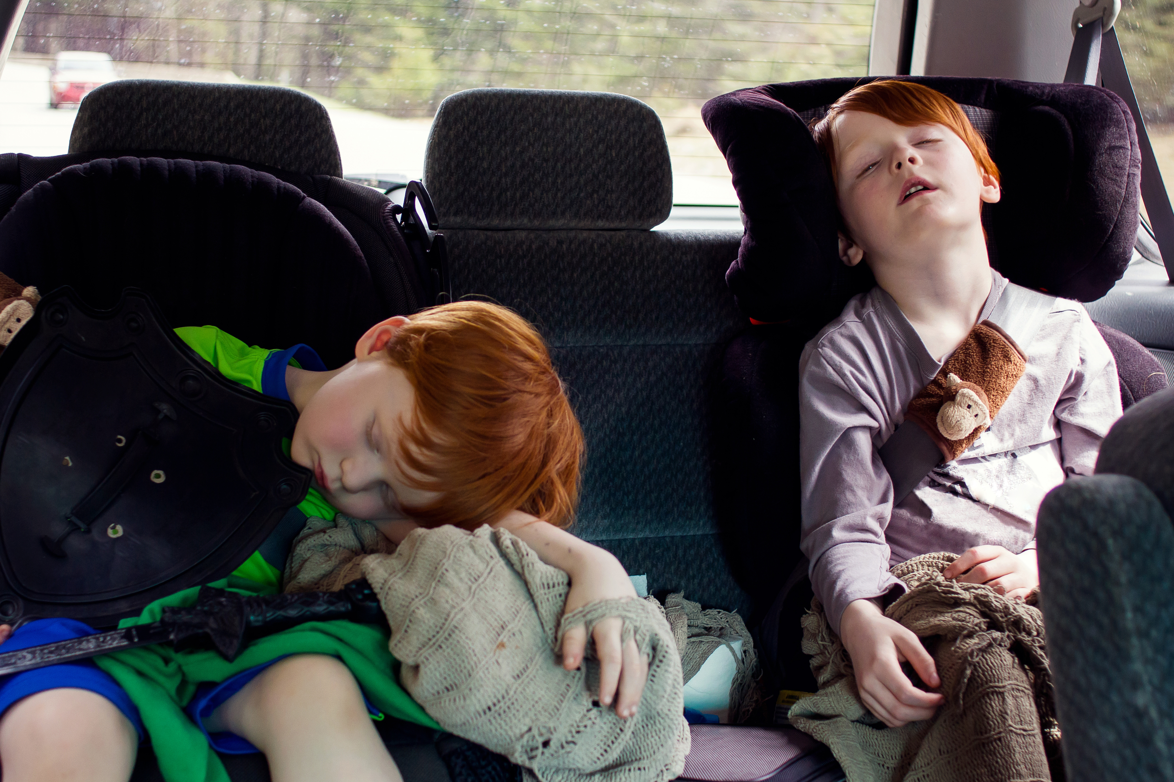 Kids sleeping in a car