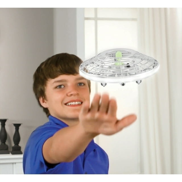 Child plays with a drone
