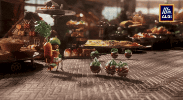 Kevin the Carrot gives presents to workers at the factory