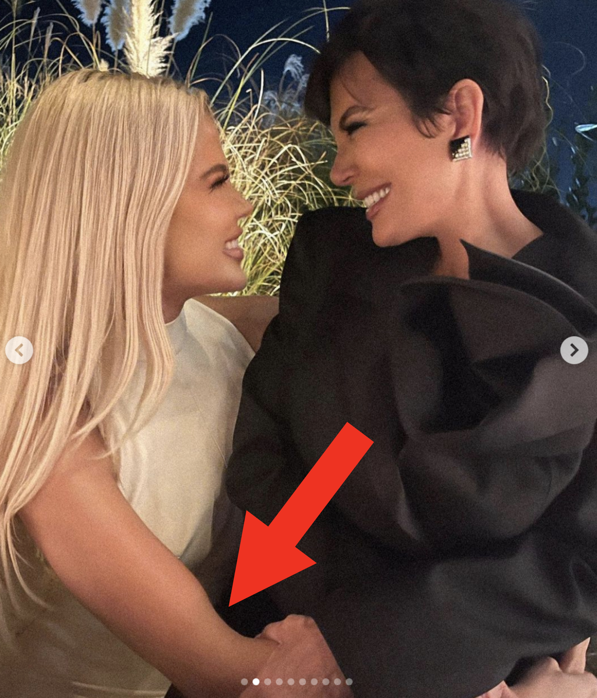 Close-up of Khloé and Kris right next to each other and smiling at each other