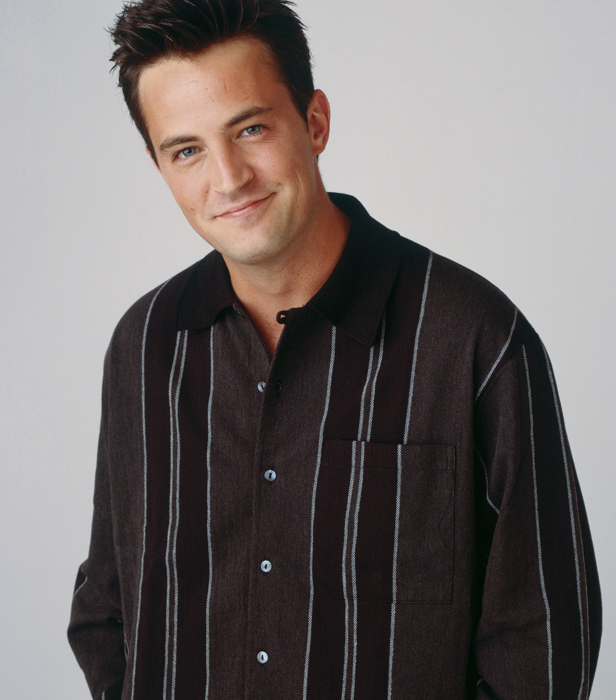 Matthew Perry smiles in a promo shot