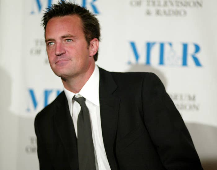 Closeup of Matthew Perry in a suit and tie