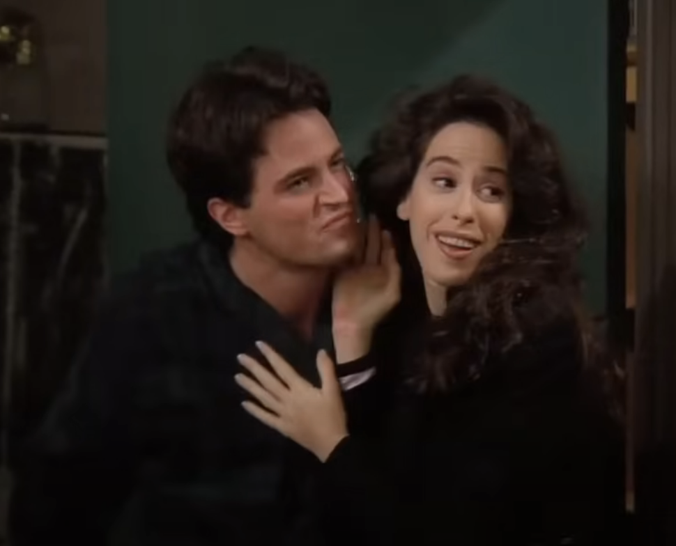 Matthew and Maggie standing closely together in a scene from &quot;Friends&quot;