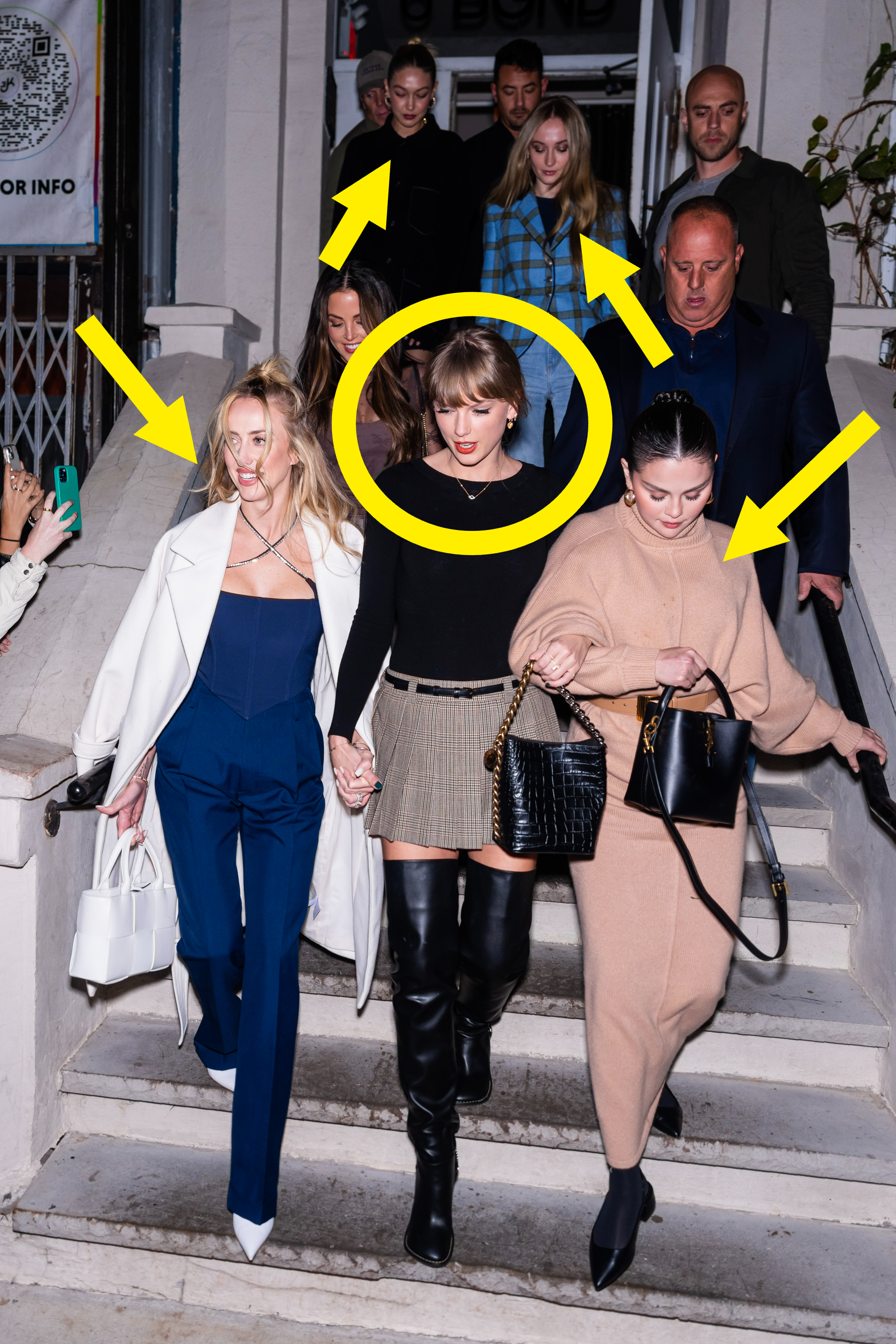 Taylor and friends exiting a building