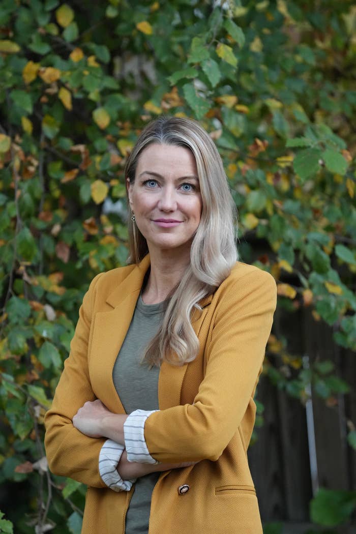 portrait of Dr. Shiels wearing a blazer and standing with her arms crossed