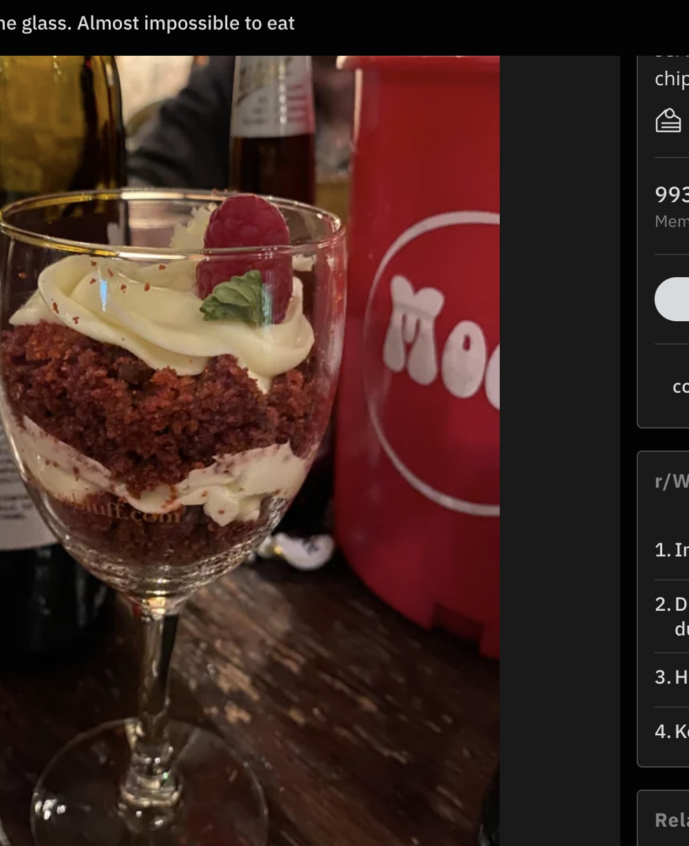 A &quot;slice&quot; of red velvet cake is inside a wine glass