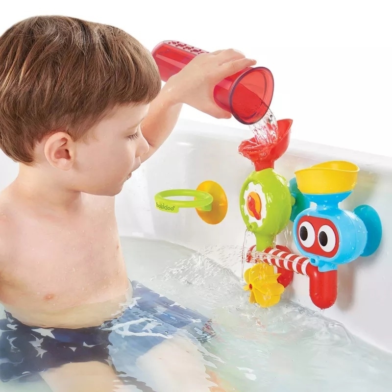 a child plays in the bath with the toy