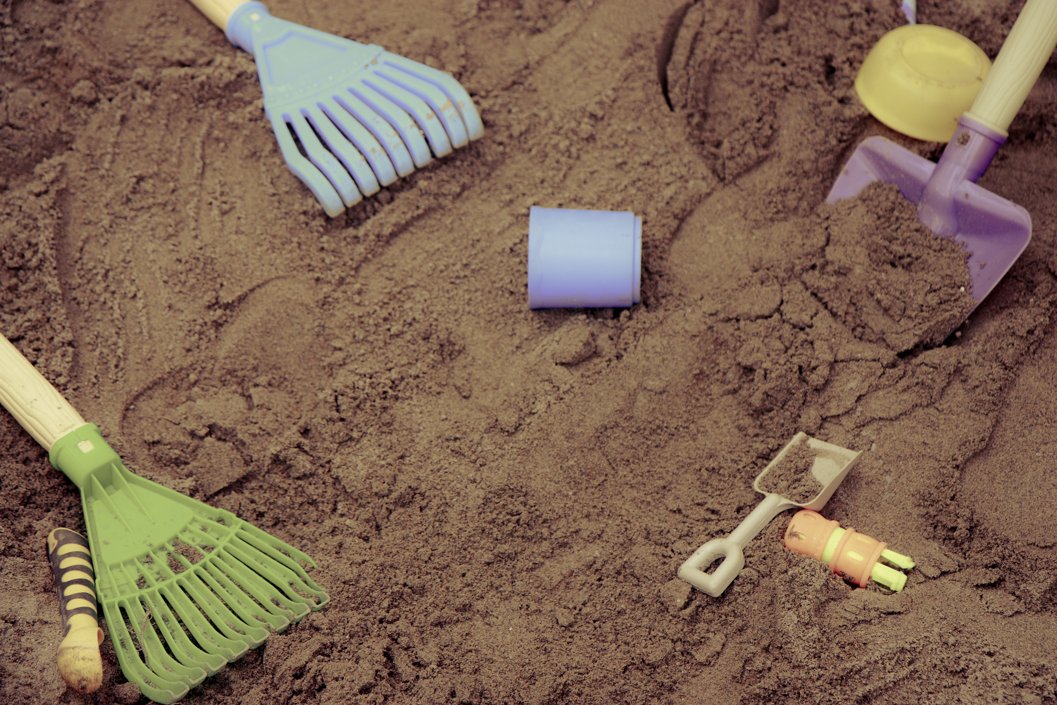 play digging toys in a sandbox