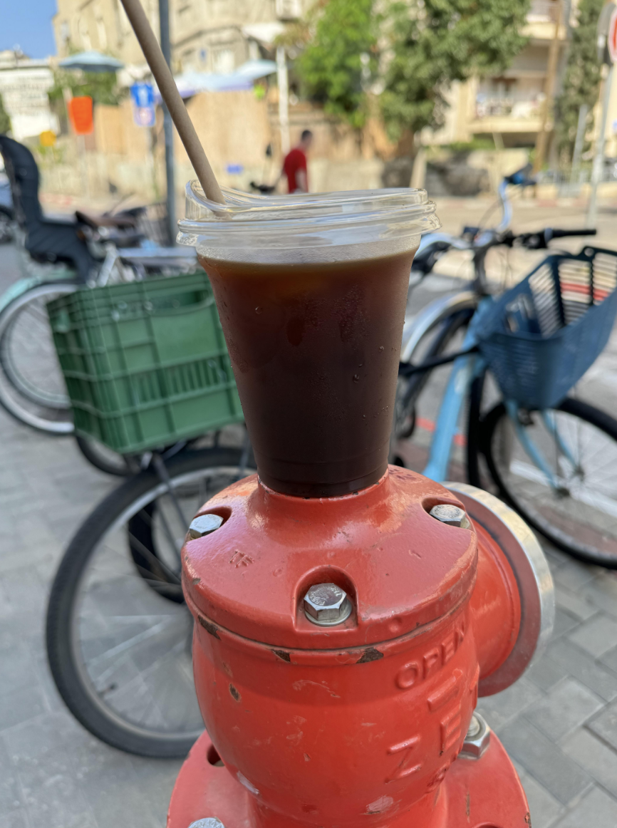 iced coffee on top of a hydrant