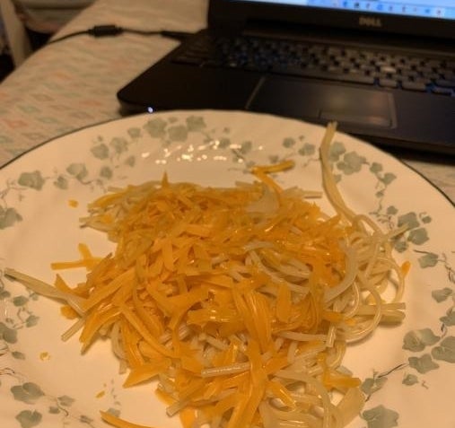 unmelted cheese on noodles
