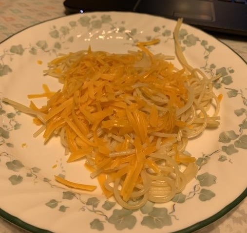 unmelted cheese on noodles