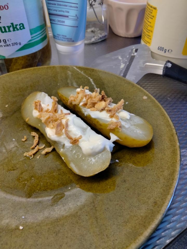mayo and fried onions on top of pickles