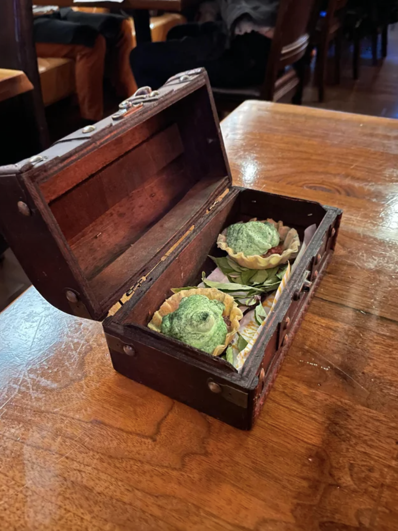 appetizers served in a little treasure chest