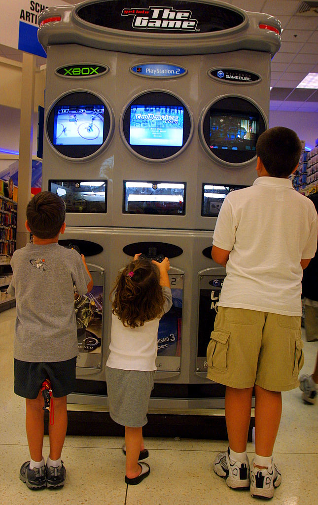 Kids playing video games in a store