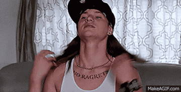 gif of guy from We&#x27;re The Millers with &quot;no ragrets&quot; tattoo