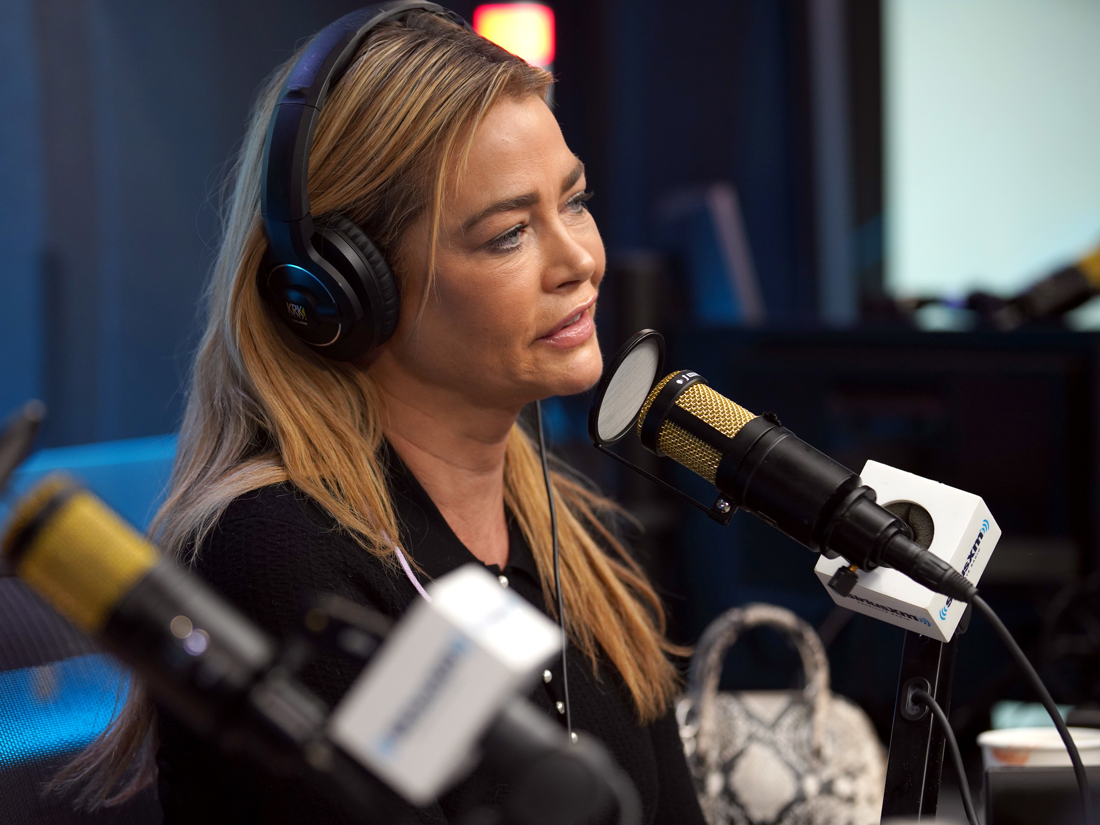 Closeup of Denise Richards doing a radio interview