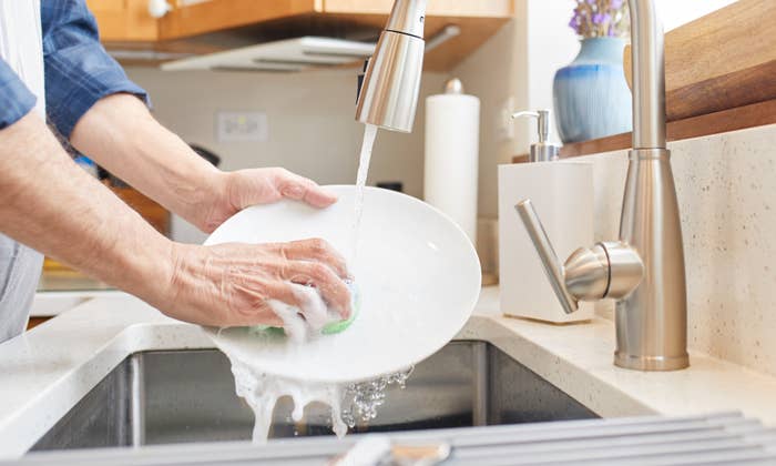 a person washing dishes